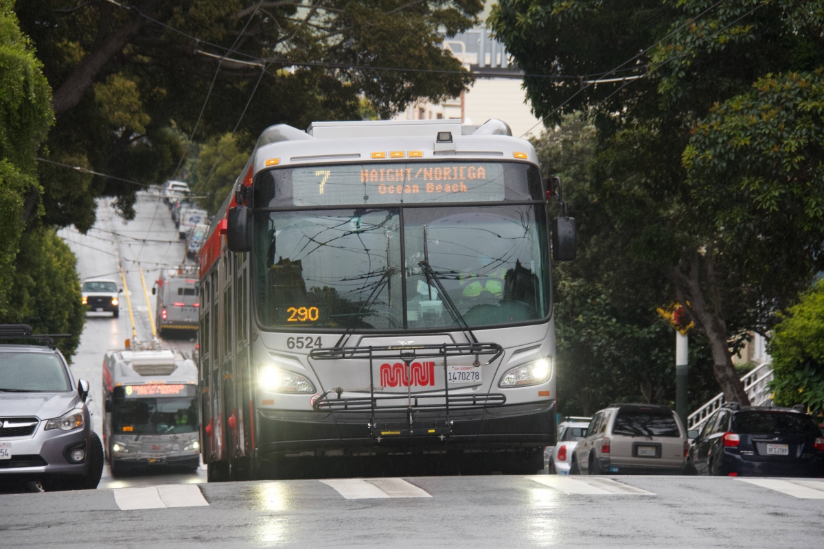 Two 6 Haight/Parnassus buses cross paths behind a 7 Haight/Noriega bus on Haight Street at Divisadero Street on April 6. Both routes were cut.