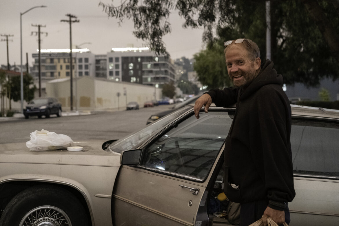 On Sept. 9, Gregory Nelson smiles for a portrait with his car on the edge of San Francisco’s Potrero Hill and Mission Bay neighborhoods. On this day, an orange sky glow falls on Bay Area residents, waiting for daylight hours to come. But a smokey sky followed for days. The North Complex fires brought more smoke and ashes, which gusty winds carried to Bay Area cities. As of Nov. 10, the North Complex fires had burned 318,935 acres, and the complex was 96% contained. It had caused 16 deaths, and 2,455 structures had been damaged or destroyed.