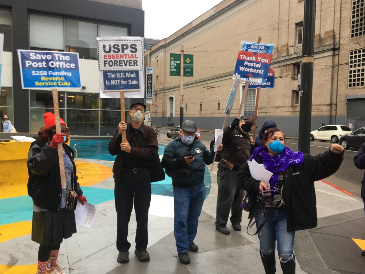 Union organizers and mail workers rally to support the postal service at Fox Plaza in San Francisco on Nov. 17, 2020
