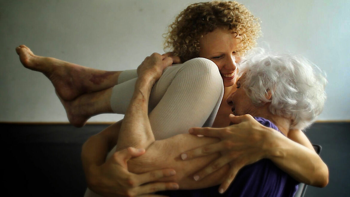 A younger dancer cradles a 90-year-old woman as they dance together. In a still from the 2019 film The Euphoria of Being, a Holocaust survivor participates in a performance with an internationally acclaimed dancer who is decades younger. The Legacy Film Festival on Aging features a slate of films exploring different aspects of aging.