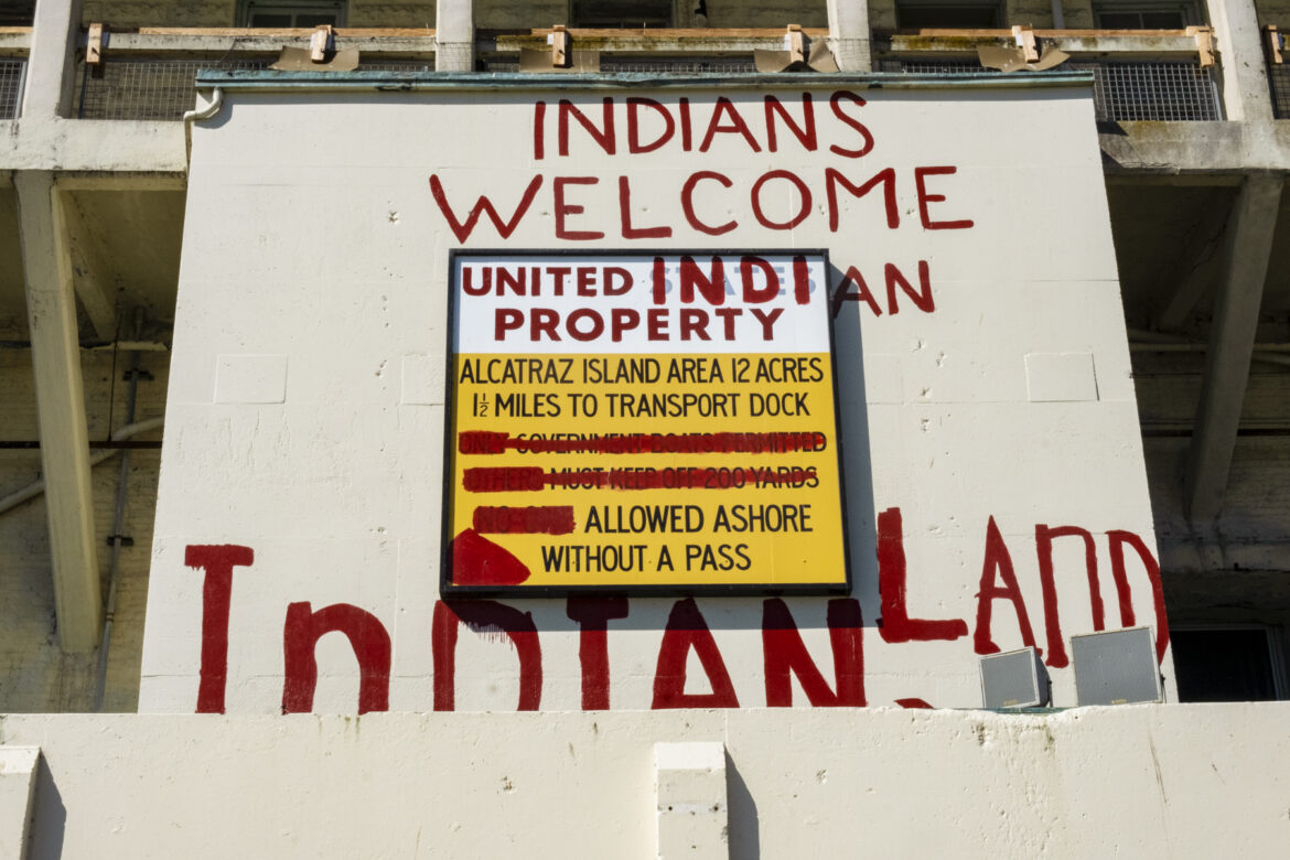 The occupiers used red paint to repurpose a penitentiary sign with a new message: “Indians Welcome. United Indian Property. Alcatraz Island. Area 12 acres. 1 ½ miles to transport dock. Allowed ashore without a pass. Indian Land.”