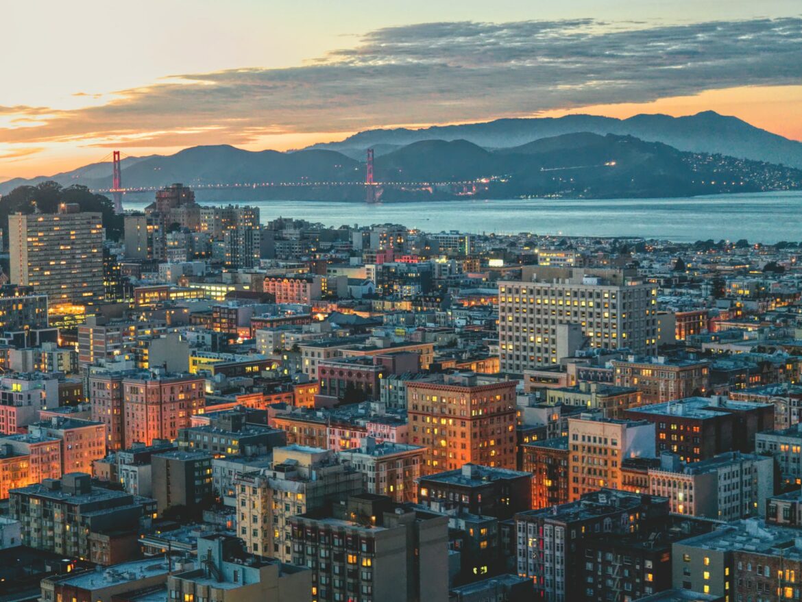 A view of San Francisco, the Golden Gate Bridge, and Marin County at sunset.