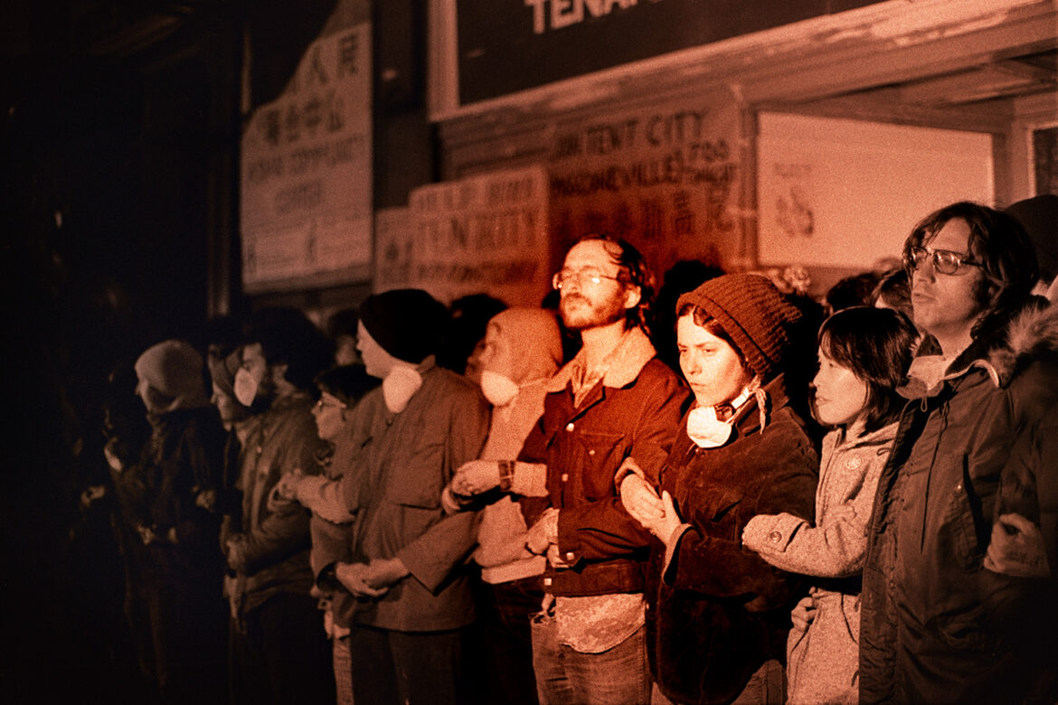 Demonstrators link arms in front of the International Hotel at Kearny and Jackson Streets in San Francisco on Aug. 4, 1977.