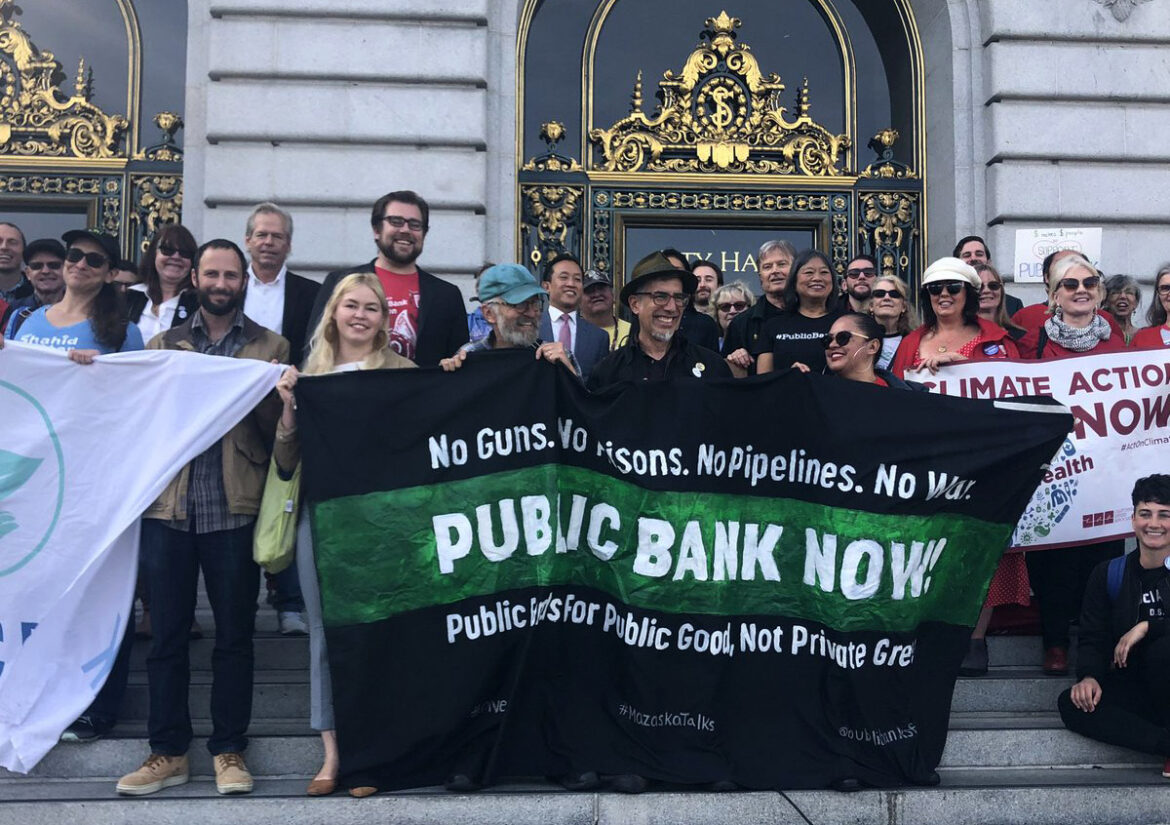 Activists rally for a public bank on the steps of San Francisco City Hall in November 2019.