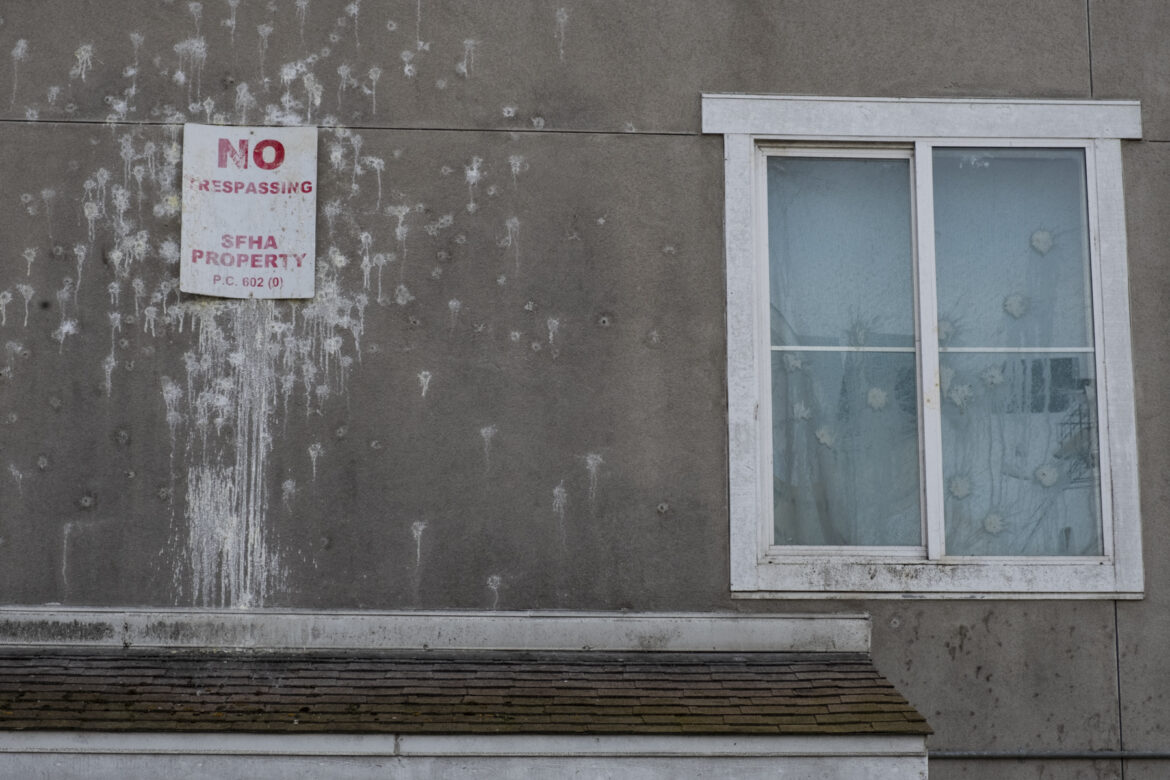 A sign covered in bird droppings that sits above a doorway at San Francisco's Plaza East public housing development reads "No Trespassing. SFHA Property." Tenants at Plaza East describe units that are as damaged and neglected on the inside as they appear externally.