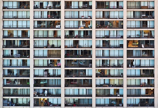 A view of dozens of apartment balconies that form a grid at Flox Plaza Apartments in San Francisco.