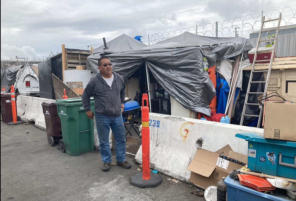 Derrick Soo lives in a makeshift shelter in a city-sanctioned homeless encampment in Oakland.