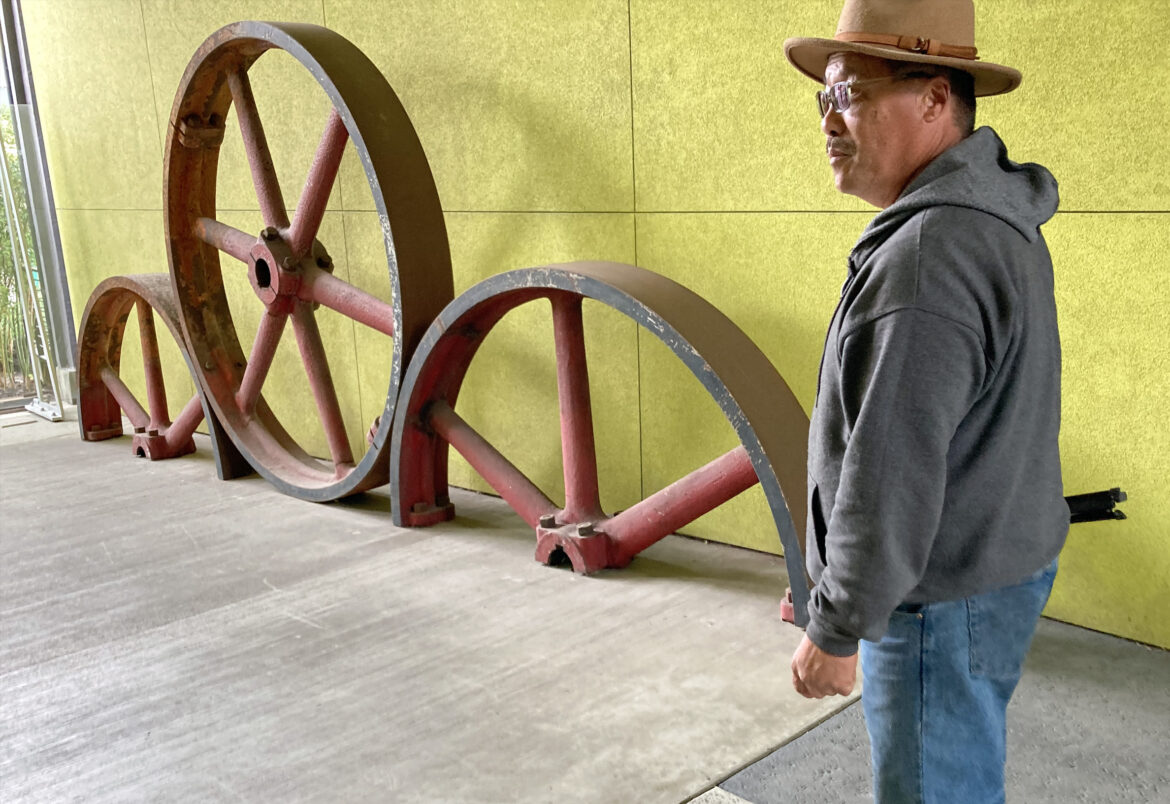 Derrick Soo walks by remnants of industrial machinery in Oakland’s Cannery Lofts, the site of his great-grandfather Lew Hing’s first cannery.