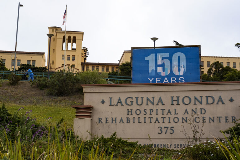 A sign on a low stone wall marks the entrance to Laguna Honda Hospital, which is visible in the background. Laguna Honda Hospital, which celebrated its 150th anniversary in 2016, is one of the county’s few publicly owned and funded skilled nursing facilities. In September, Laguna Honda will apply for recertification from the Centers for Medicare and Medicaid Services.