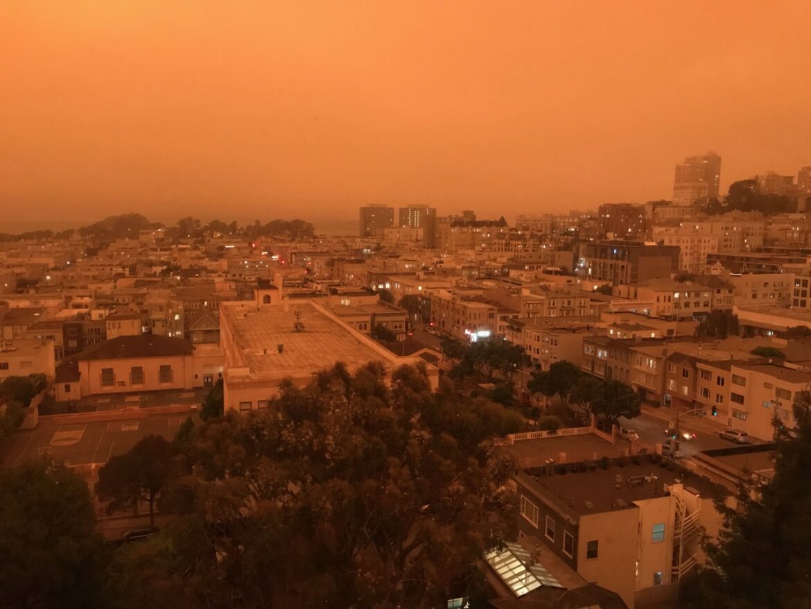 Wildfire smoke casts an orange glow over San Francisco streets in 2020.