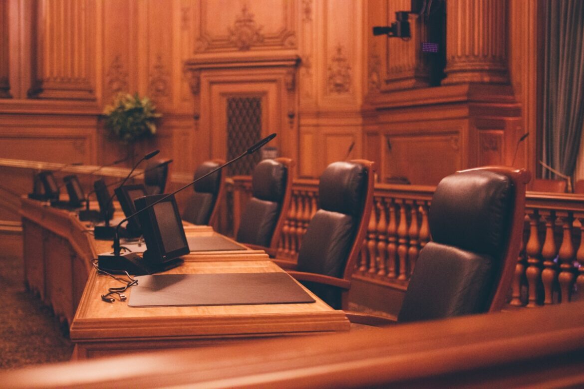 Empty chairs at public meeting space inside San Francisco City Hall.