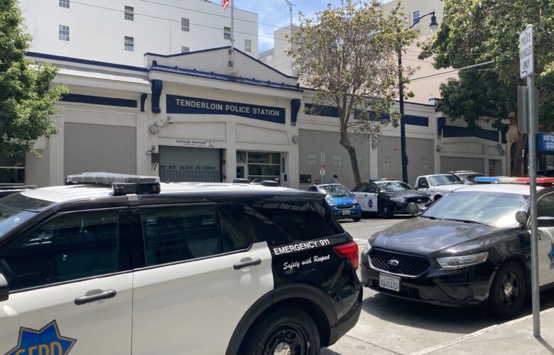 Several San Francisco Police Department vehicles are parked in front of the Tenderloin Police Station.