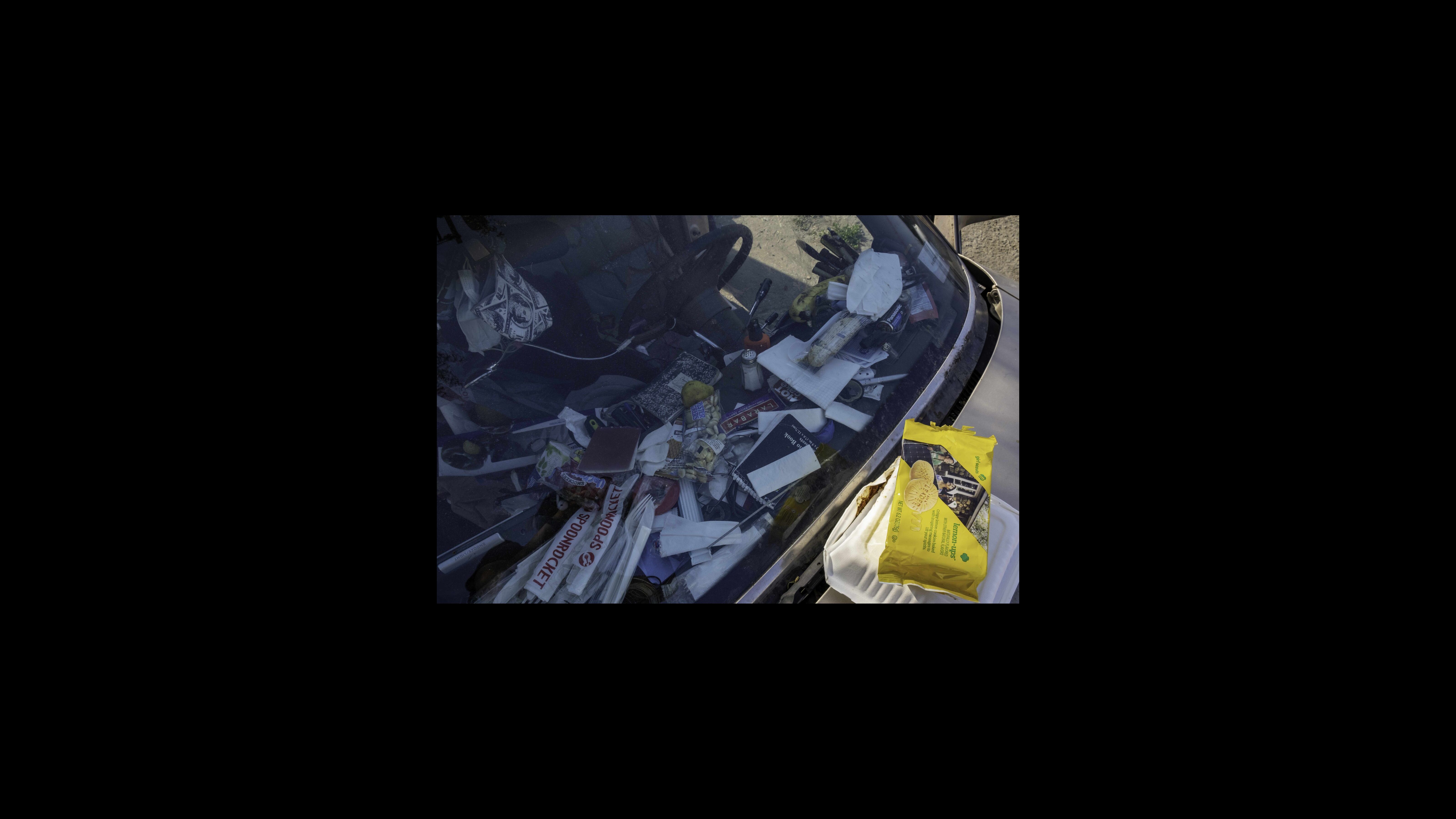 For the past year, Gregory Nelson’s home has been a 1986 Cadillac. During the shelter-in-place order, he spends most of his days hanging out inside his vehicle on the edge of the tow yard where he used to be employed and now does odd jobs. Nelson uses his vehicle’s dashboard to store small everyday essentials like snacks, utensils, batteries, pencils, notepads and masks. For the past year, Gregory Nelson’s home has been a 1986 Cadillac. During the shelter-in-place order, he spends most of his days hanging out inside his vehicle on the edge of the tow yard where he used to be employed and now does odd jobs. Nelson uses his vehicle’s dashboard to store small everyday essentials like snacks, utensils, batteries, pencils, notepads and masks.