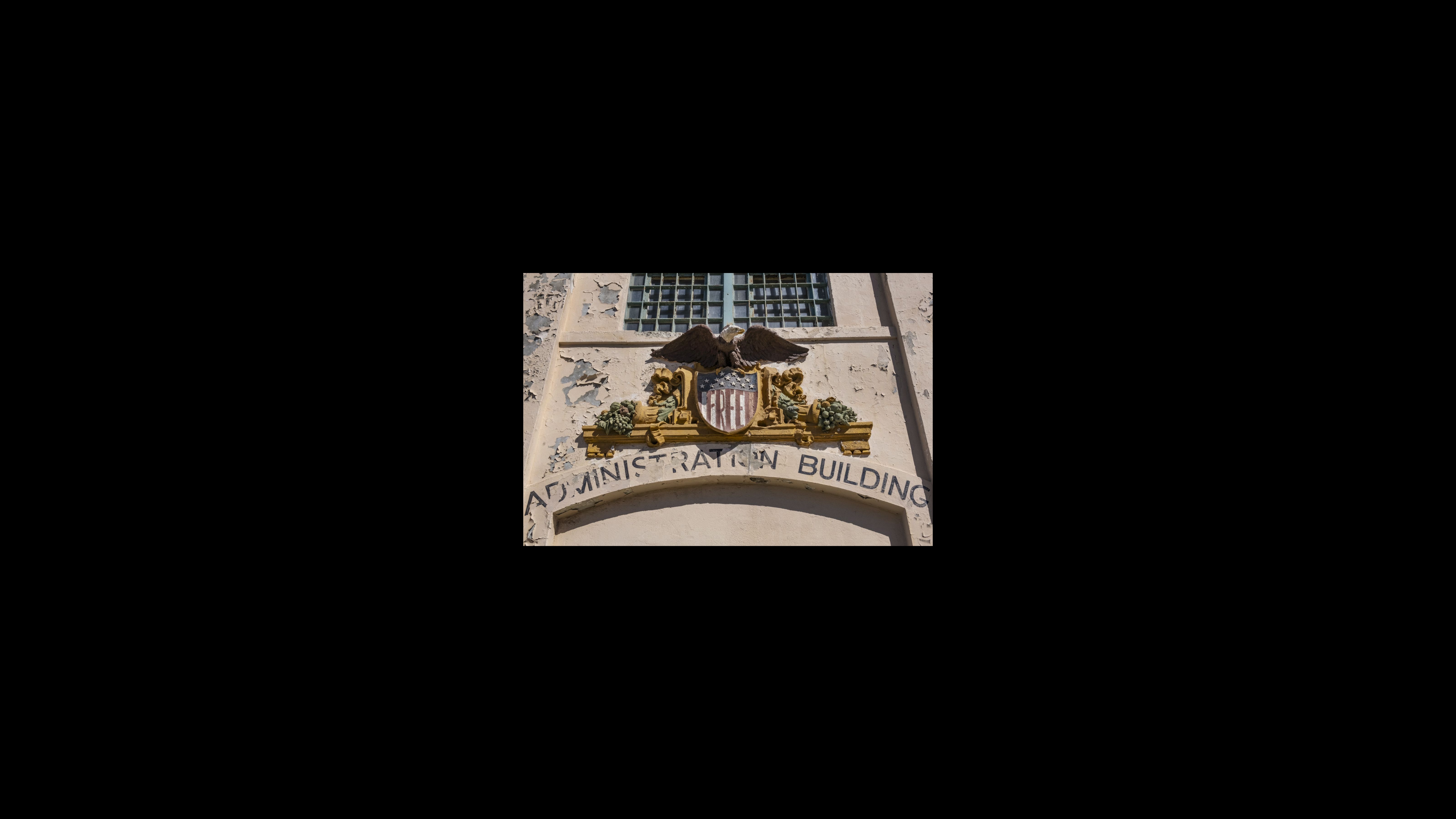 Eagle Plaza, the entrance of the cell house building, features a Bald Eagle above a shield, which occupiers repainted with the word “Free.”
“A tiny island is a symbol of our once great land,” War Jack wrote. “What this island stands for, will grow as a seed through our great country and again, be free as our tiny island is now.” Eagle Plaza, the entrance of the cell house building, features a Bald Eagle above a shield, which occupiers repainted with the word “Free.”