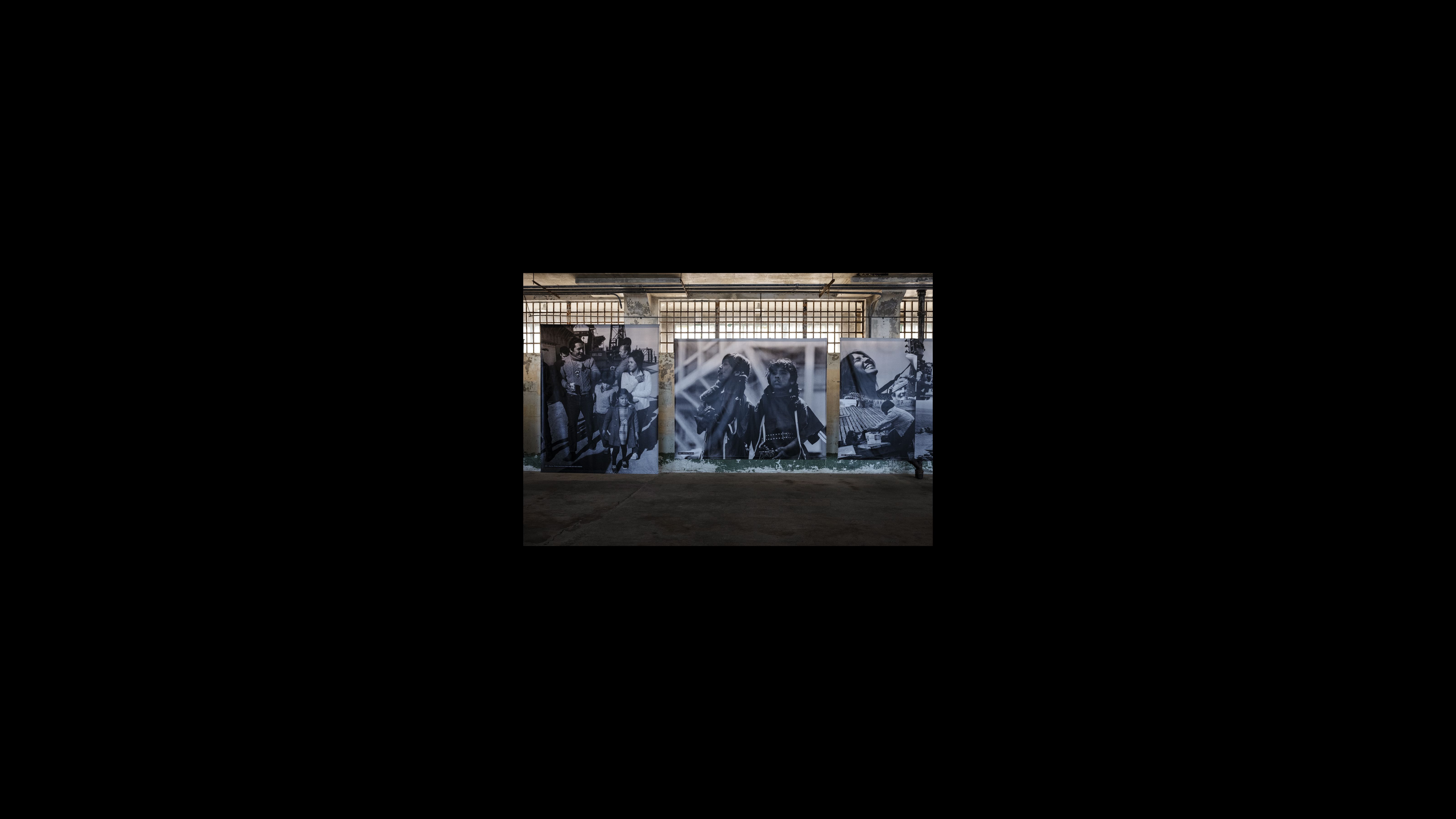 The exhibit features large canvases from photographers Brooks Townes, Ilka Hartmann and Stephen Shames, original materials and artifacts collected by Kent Blansett, visual storyboards created by Kris Longoria (aka UrbanRezLife) and contributions from the community of occupiers. In the images shown here, Shames captured young families and children who occupied Alcatraz. Families were a common sight on the island, and the activists opened a school for the children. Large photos on canvases depict young families and children on Alcatraz during the occupation.