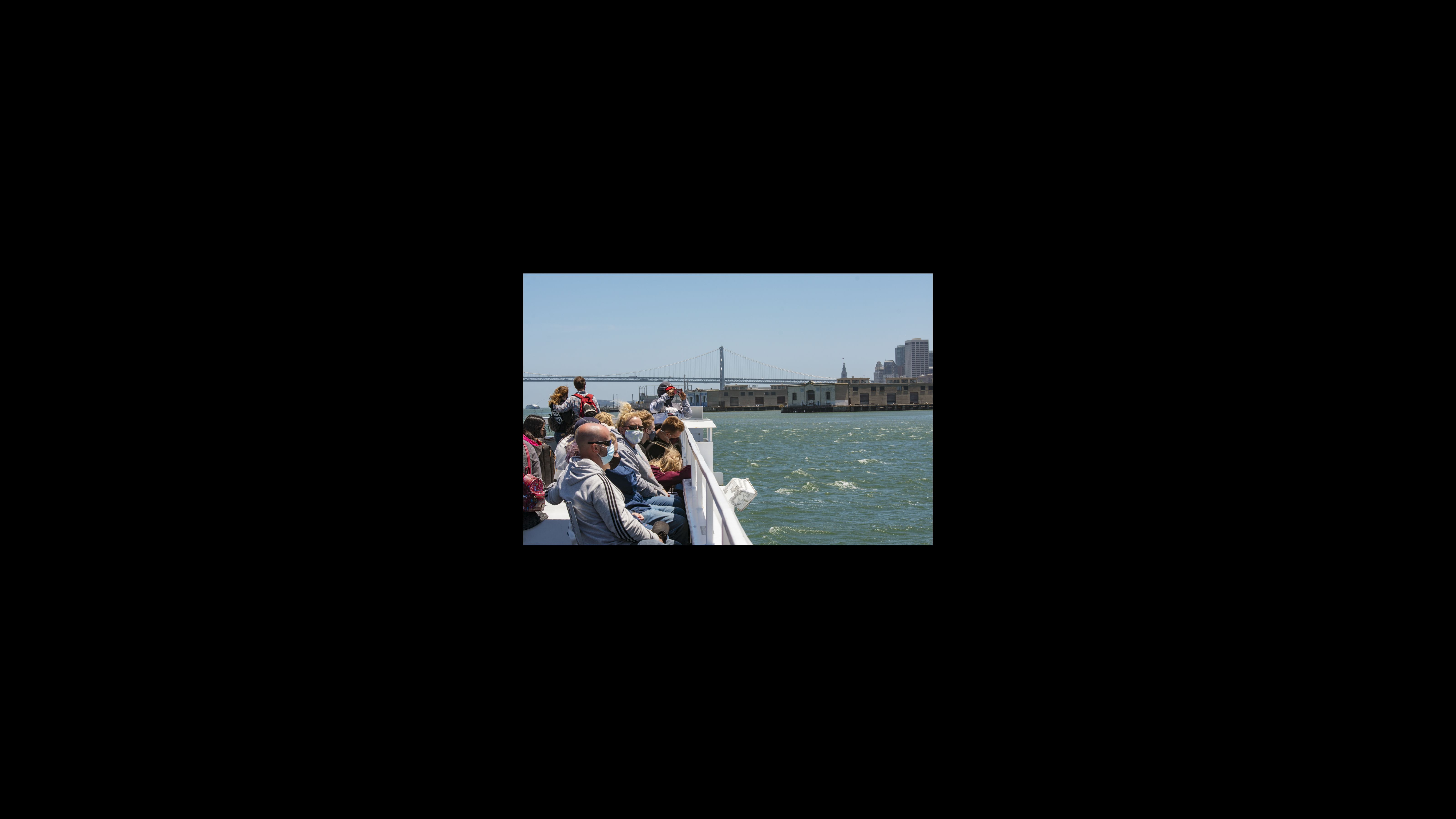Visitors ride the Alcatraz Cruise across San Francisco Bay to return to the city. As the afternoon boat departs, visitors have a final view of the red graffiti marking the occupation. For many visitors, the Red Power on Alcatraz exhibition shined light on the issues affecting Indigenous communities.
“It’s shocking actually to just kind of understand some of the atrocities that were permitted to transpire against the Native American people of our nation,” said a visitor from Kansas on the boat. “And to think 47 cents an acre was an acceptable amount for us to give them as far as reparations for that time. It’s overwhelming,” he said. Visitors ride the Alcatraz Cruise across San Francisco Bay to return to the city.