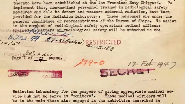 The era’s history survives in part as handwritten notes scrawled across typewritten memos and carbon copies. A 1947 memo from the Bureau of Medicine and Surgery to the Navy lab describes plans to keep two sets of health records — one for the benefit of shipyard workers, and a separate one for researchers to aggregate as data about human radiation exposure. Source: National Archives and Records Administration. A yellowing typewritten memo stamped secret, with many handwritten notes.